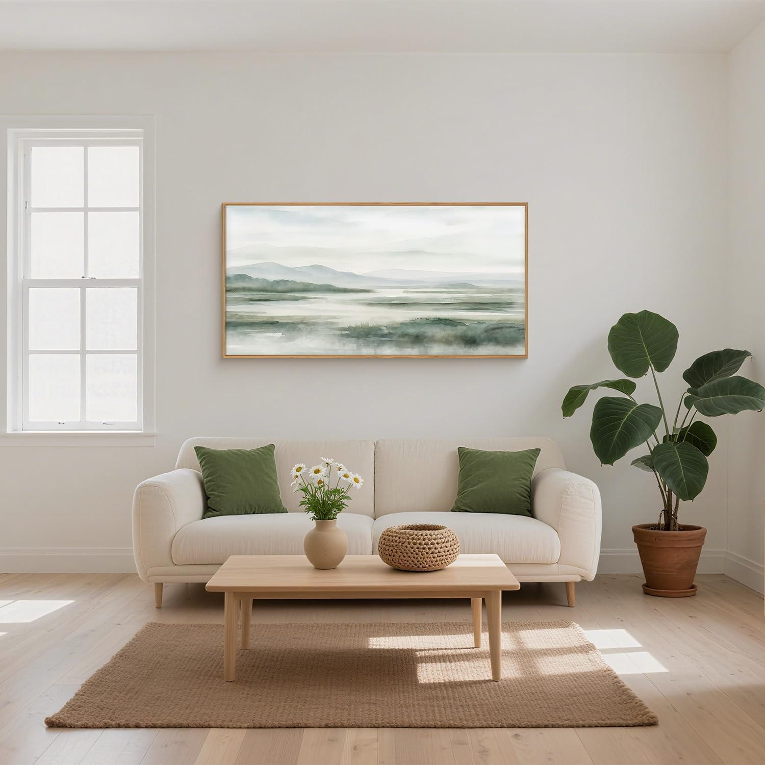 Inramad grön landskapstavla med abstrakt naturmotiv ovanför en soffa.