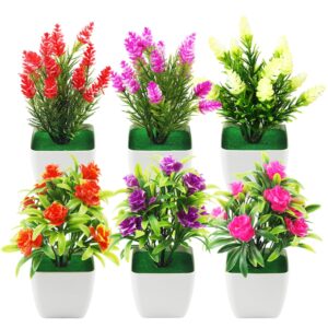 Sex konstgjorda blomväxter i vita krukor med färgglada blommor.